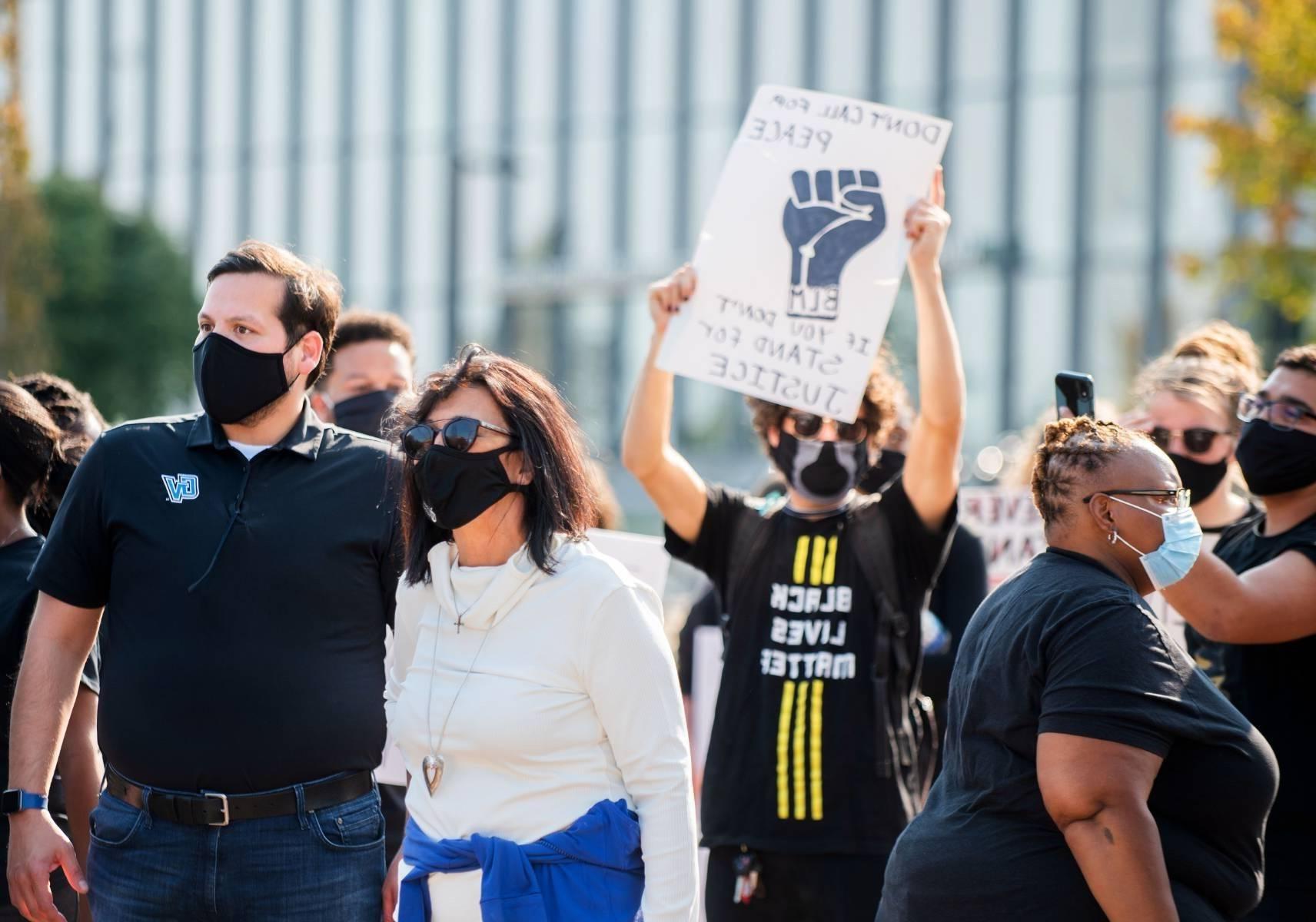 Philomena Mantella and Jesse Bernal attending a Black Lives Matter protest. Multiple protesting students are in the background.